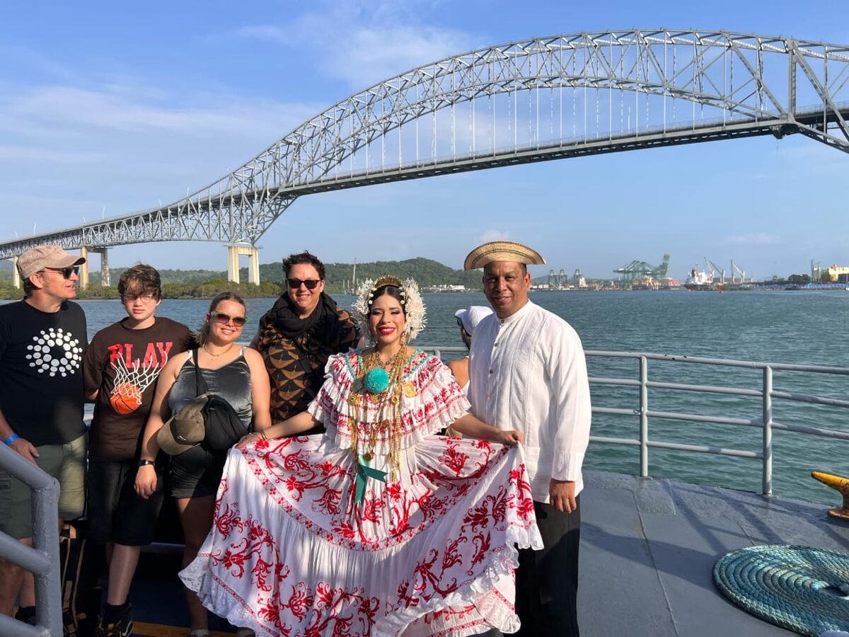 Family with traditional dancers at Bridge of Americas
